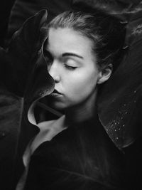 Close-up portrait of young woman looking away