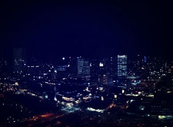 Illuminated cityscape at night