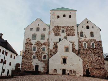 Low angle view of old building against sky