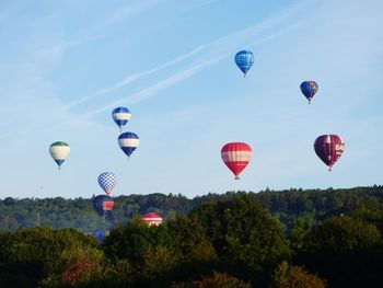 Low angle view of hot air balloons against sky