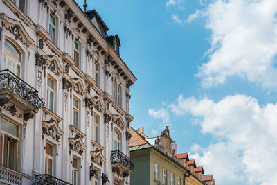 Low angle view of building against cloudy sky