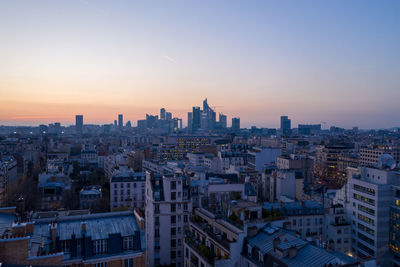 High angle view of city buildings during sunset