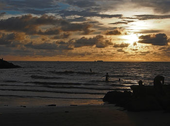 Scenic view of sea against cloudy sky