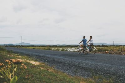 Person riding bicycle on road