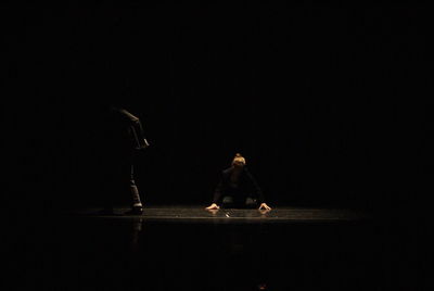 Man and woman dancing on stage