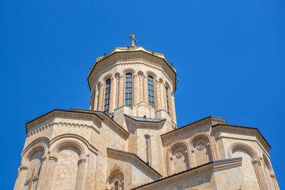 Low angle view of a building against blue sky