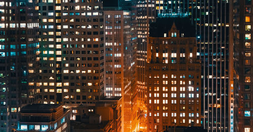 Illuminated buildings in city at night