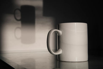 Close-up of coffee cup on table