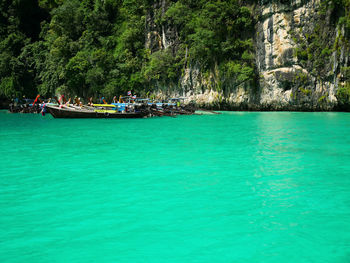 Long-tail boats with crystal clear water at pileh lagoon, krabi, thailand