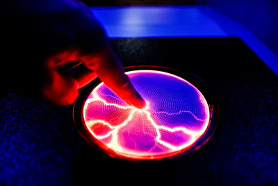 Close-up of hand holding illuminated light painting