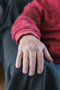 Midsection of woman holding hands