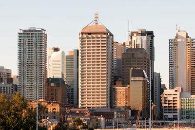 Modern buildings in city against sky