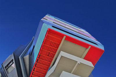 Low angle view of building against clear blue sky