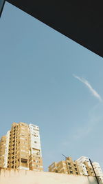 Low angle view of building against clear blue sky