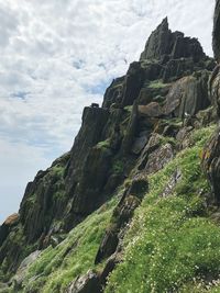 Low angle view of rock formations against sky