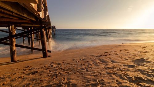 Scenic view of sea against clear sky during sunset