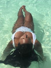 High angle view of young woman in swimming pool