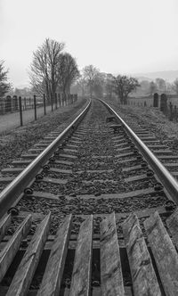 Railroad track against clear sky