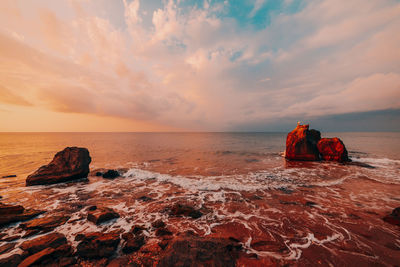 Scenic view of sea against sky during sunset