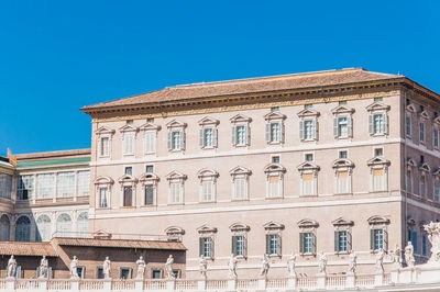 Low angle view of building against blue sky