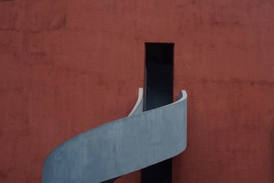 Close-up of concrete railing on brown building