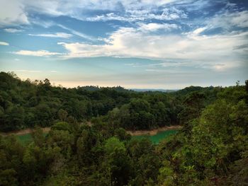 Scenic view of landscape against cloudy sky