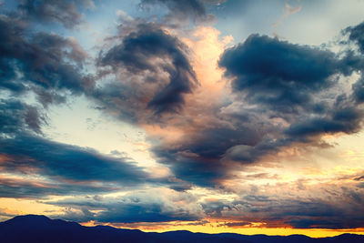 Scenic view of landscape against cloudy sky