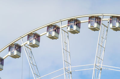 Detail of a giant ferris wheel against the sky