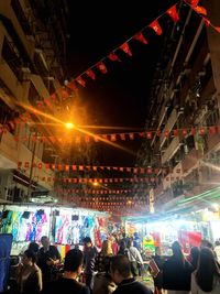 Group of people in illuminated building at night