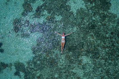 High angle view of person swimming in sea