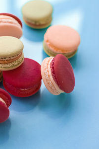 Close-up of macaroons on blue background