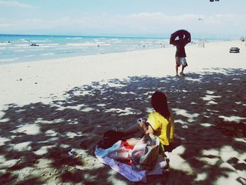 Woman standing on beach