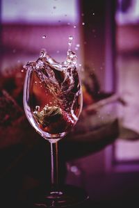 Close-up of drink splashing in glass