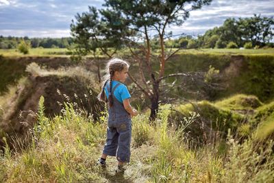 Full length of boy on field