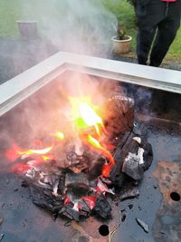 High angle view of fire on barbecue grill