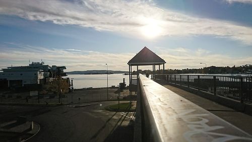 Lifeguard hut by sea against sky