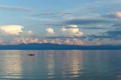 Scenic view of sea against cloudy sky