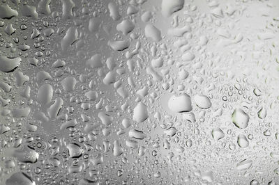 Water splashes on clear mirror background