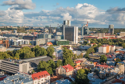 High angle view of buildings in city against sky