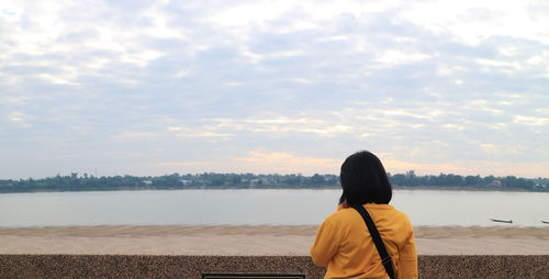 Standing female tourists and background of the mekong river, thailand-laos