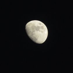 Low angle view of moon against sky at night