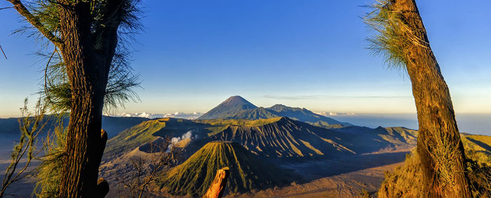 Panoramic view of landscape against clear blue sky