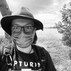 Portrait of man wearing hat standing outdoors