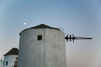 Low angle view of cross against clear sky