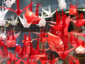 Close-up of red flags hanging on clothesline