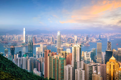 Aerial view of city buildings against sky