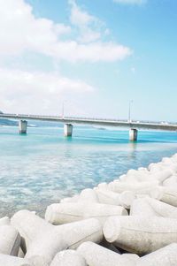 Bridge over sea against sky