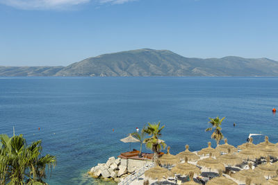 Scenic view of sea against blue sky