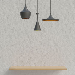 Low angle view of pendant light hanging on wall