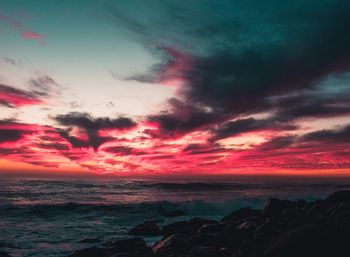 Scenic view of sea against dramatic sky